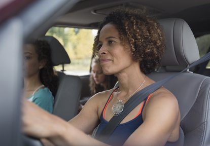 Auto Plus Insurance Group LLC | Woman driving with daughter in her car
